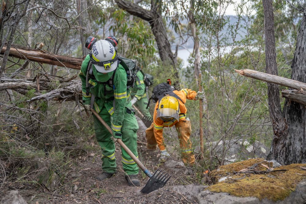 FFMVic and Queensland Rural Fire Service firefighters fighting the fire at Grampians (Gariwerd) National Park Bushfire in late December