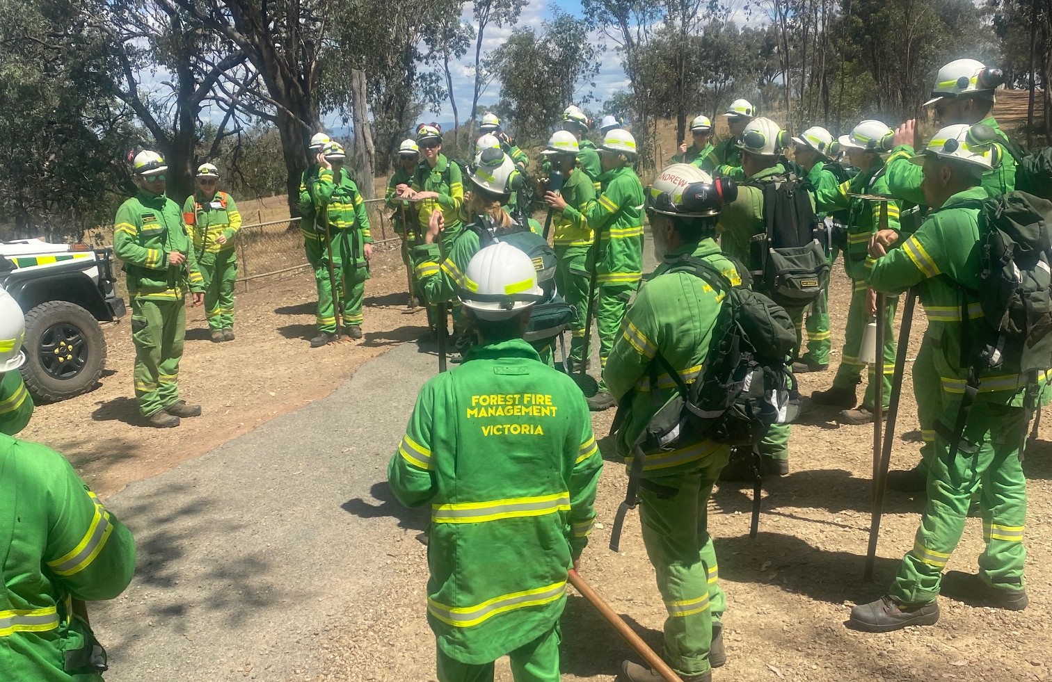 A group of FFMVic firefighters attending a debrief with  some trainees