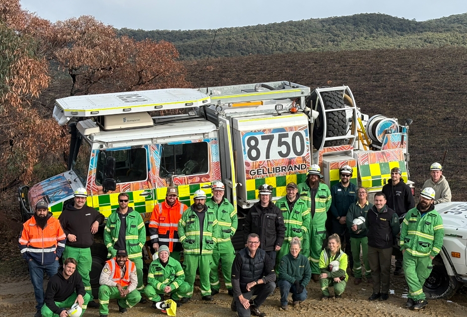 group of firefighters in front of truck labelled 'Gellibrand'