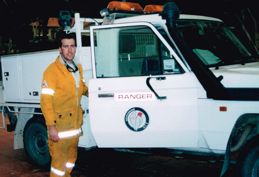 Aaron standing outside of a ranger vehicle