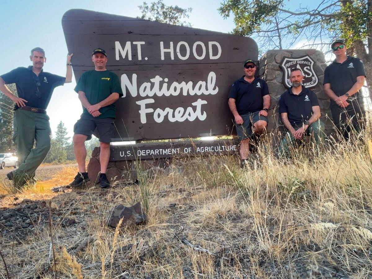 FFMVic staff with other US members in front of a Mt Hood National Forest sign