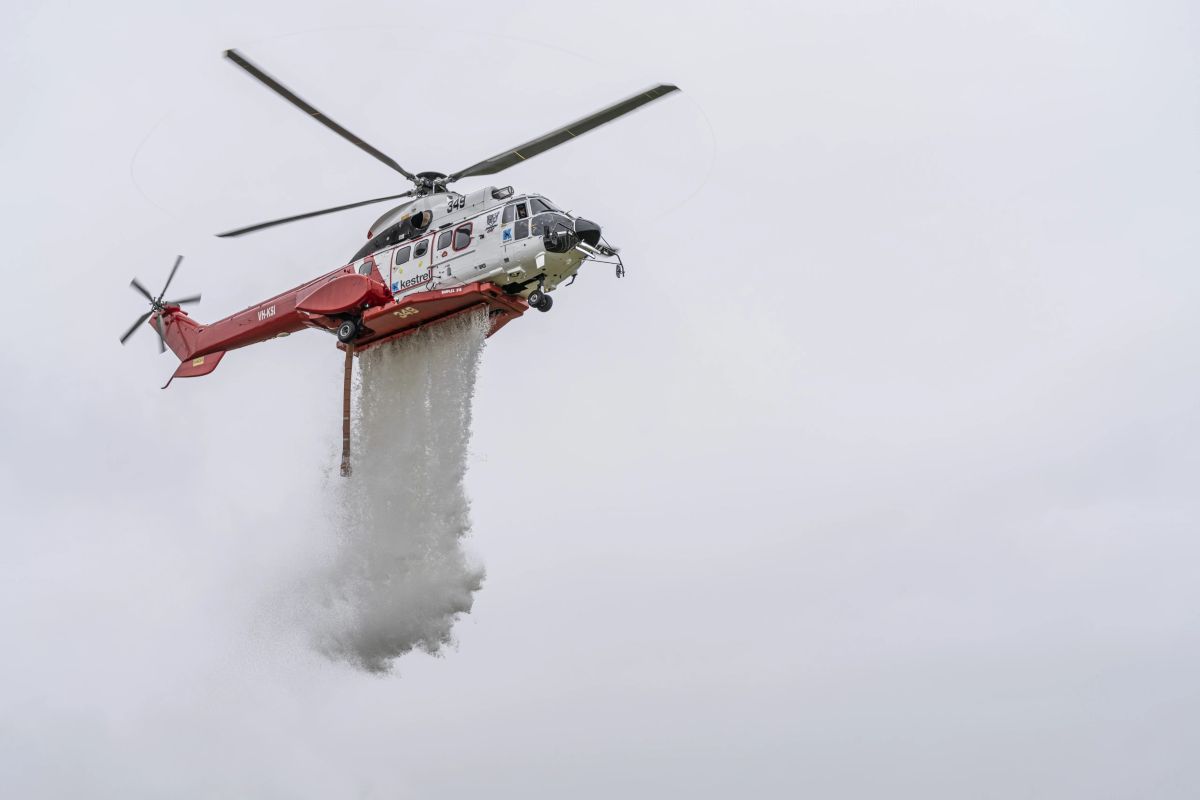 Helicopter releasing water